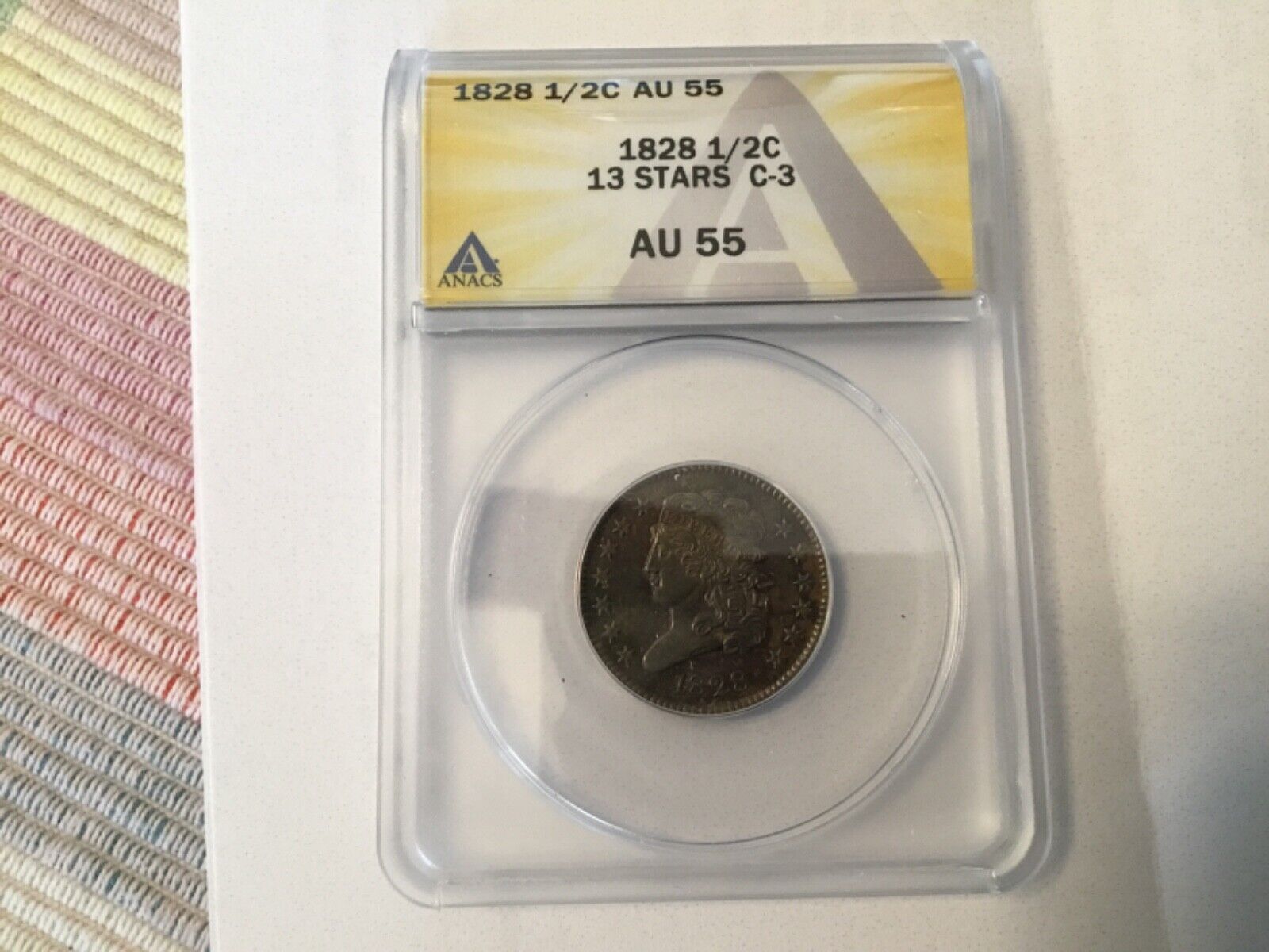 1828 Half Cent — Graded AU55 by ANACS - Brown/Red 13 stars